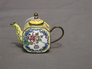 An Oriental yellow and floral pattern miniature teapot 3"