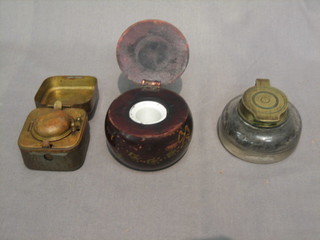 A 19th Century brass travelling inkwell with hinged lid 2", a circular glass inkwell 3" and an Eastern carved inkwell with hinged lid 3"