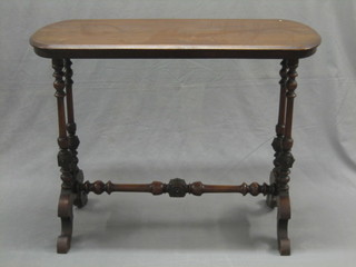 A Victorian rectangular mahogany stretcher table raised on turned supports 35"