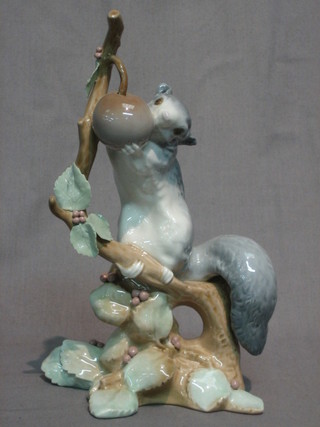 A Lladro figure of a squirrel on a tree stump (branch f) 9"