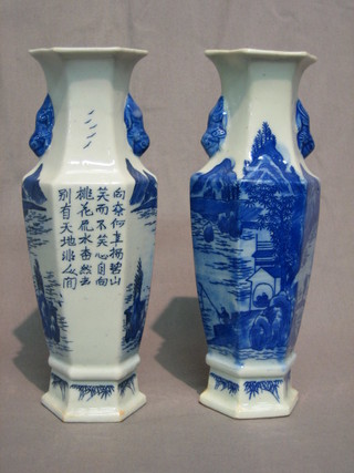 A pair of 19th Century Oriental blue and white octagonal shaped vases decorated a landscape, the reverse with script 9 1/2"