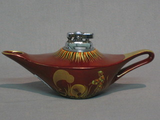 A table lighter contained in a Carltonware Rouge Royal frame in the form of an Aladdin's lamp, the base marked Carltonware, hand painted Rouge Royal 9"