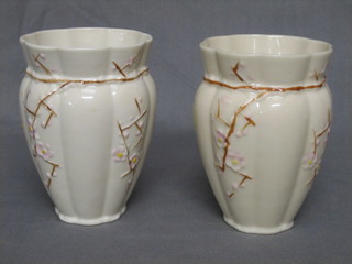 A pair of 20th Century Beleek vases, the base with brown mark 4 1/2"