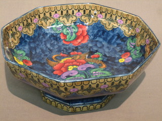 A 1930's Lotusware octagonal blue lustre bowl with floral decoration, raised on a spreading foot 10"