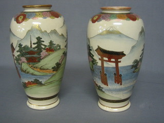 A pair of late Satsuma Japanese pottery vases the bases with seal marks 10"