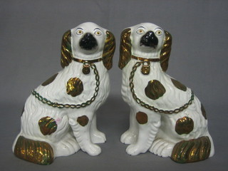A pair of 19th Century Staffordshire figures of seated Spaniels 9" (1f)