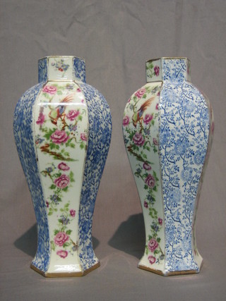 A pair of Edwardian octagonal pottery vases with floral and blue and white panel decoration 10"