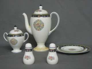 A 48 piece Wedgwood Runnymead pattern dinner service comprising 2 vegetable tureens and covers (1 cracked lid), 15" meat plate, sauce boat and stand, 9 dinner plates 10 1/2", 9" side plates, 12 tea plates 8", 8 side plates 6", 2 saucers 6" and 5 1/2", coffee pot, twin handled sucrier and cream jug, preserve jar, ginger jar and cover, trumpet shaped jar 4", salt and pepper pot, 3 various coffee cans