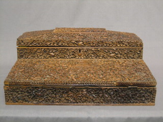 A Burmese carved hardwood writing slope with hinged lid fitted compartments 16"    