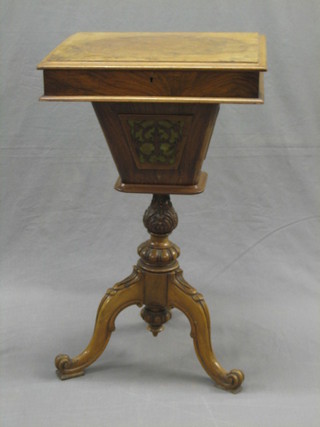 A Victorian rectangular figured walnut work table with hinged lid, the body of conical form with pierced panels raised on a well carved column and tripod base 18" (slight warp to lid and some fret work missing)