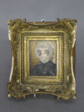 An 18th/19th Century portrait miniature on ivory of a bonnetted lady 3" x 3 1/2" contained in a decorative gilt frame