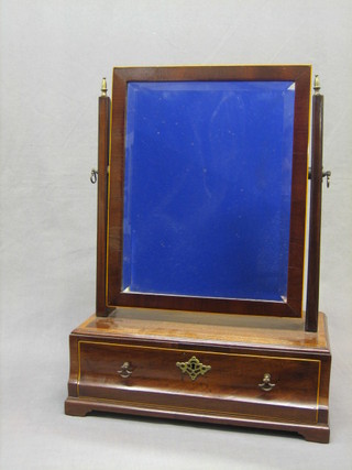 A Queen Anne style rectangular bevelled plate dressing table mirror contained in a mahogany swing frame on a crossbanded base fitted a drawer, raised on bracket feet 15"