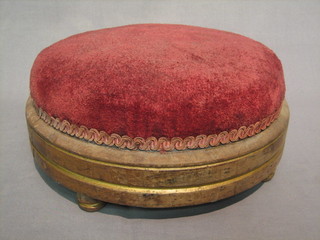 A circular Victorian mahogany foot stool, raised on 4 bun feet (1 replaced) 12"