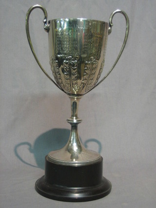 A Victorian embossed silver twin handled presentation trophy London 1897 12 ozs engraved