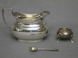 A Georgian style silver cream jug, Chester, marks rubbed and a small Victorian silver salt and spoon, 5 ozs