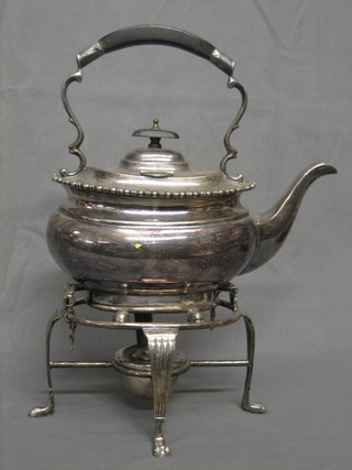 A Georgian style silver plated spirit kettle complete with burner