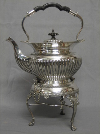 A circular silver plated tea kettle and stand with demi-reeded decoration, complete with burner 