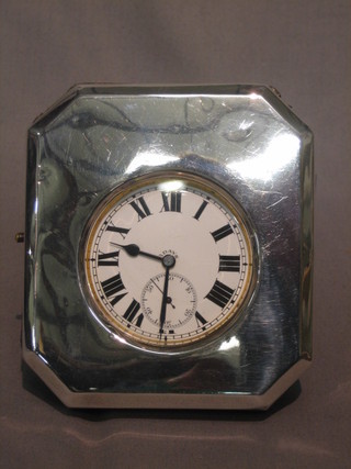 A Victorian 8 day open faced pocket watch contained in a silver easel frame, London 1869