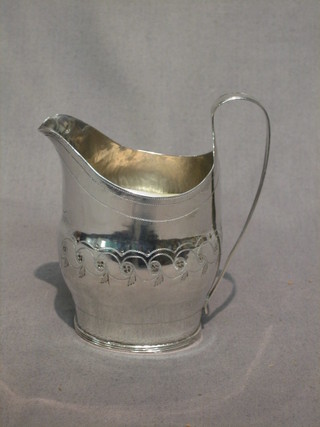 A Georgian silver cream jug with engraved decoration (marks rubbed) 2 ozs