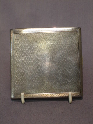 A silver cigarette case with engine turned decoration Birmingham 1924 4 ozs