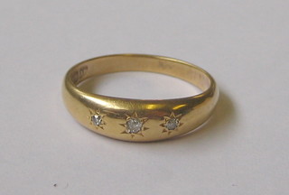 A lady's 18ct gold dress ring set 3 small diamonds