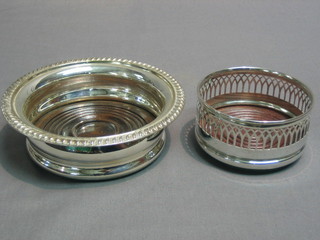 A circular silver plated wine bottle coaster 5" and 1 other 3"