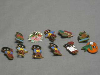 6 Robinson Gollywog badges - 2 tennis players, golfer, motorcyclist, standing Gollywog, Lollipop Lady and a Robinson's badge, an orange badge (f), a Robinson's strawberry badge, a badge marked Golly and 1 other badge marked Fluffy Cat