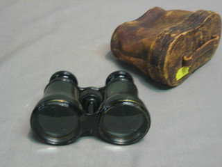 A pair of 19th Century opera glasses by J H Steward, London contained in a leather carrying case