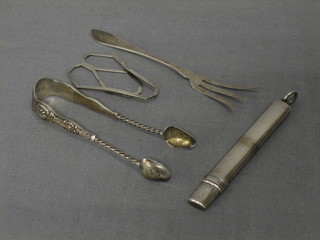 A silver money clip, a pair of silver sugar tongs, a silver pencil holder and a small silver fork