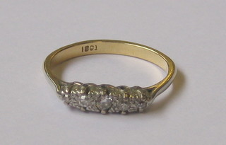 A lady's 18ct gold dress ring with illusion set diamonds