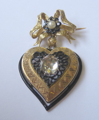 A handsome 19th Century gold heart shaped pendant brooch set a diamond