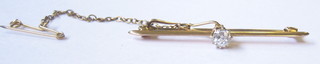 A lady's 15ct gold bar brooch set a diamond