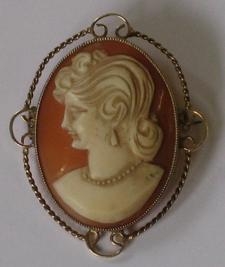 A lady's shell carved cameo portrait brooch contained in a 9ct gold mount