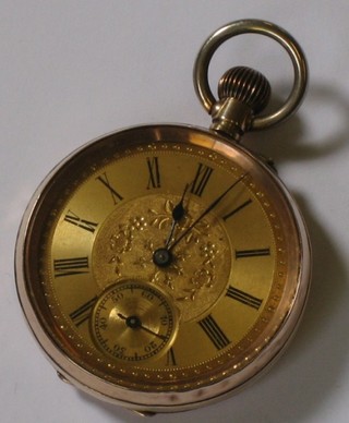 An open faced pocket watch contained in a  "gold" case 