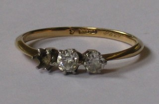 A lady's 3 stone gold dress ring set diamonds (1 missing)