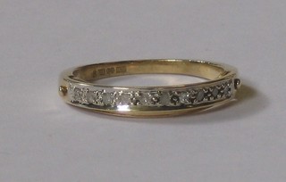 An 18ct gold half eternity ring set diamonds