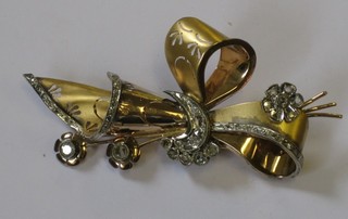 An 18ct Continental gold spray brooch set 11 large diamonds supported by other diamonds