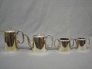 A silver plated 4 piece hotelware tea service comprising teapot, hotwater jug, twin handled sugar bowl and cream jug