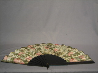 A Victorian ebony fan with floral decoration