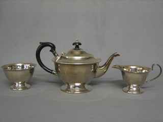 A silver plated circular 3 piece tea service comprising teapot, sugar bowl and cream jug
