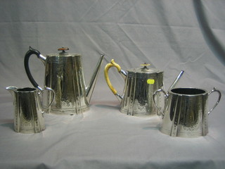 A 4 piece oval engraved silver plated tea/coffee service comprising coffee pot, teapot, twin handled sugar bowl and cream jug