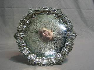 A circular silver plated salver with bracketed border 13"