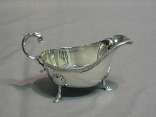 A Georgian style silver plated sauce boat with C scroll handle by James Dixon & sons
