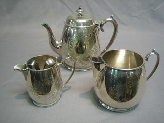 A silver plated 3 piece tea service with teapot, cream jug and milk jug, a pair of plated tongs and a teaspoon