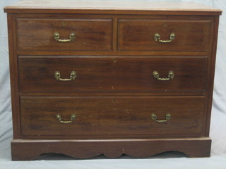 An Edwardian walnut chest of 2 short and 2 long drawers raised on a platform base 42"