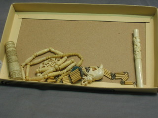 A bone cigarette holder, do. needle case, ivory elephant and 2 bone necklaces