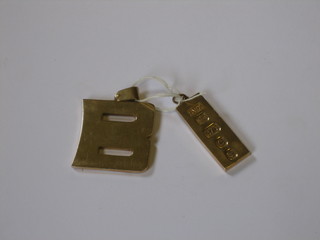 A 9ct gold B and a 9ct gold ingot pendant, 2 ozs