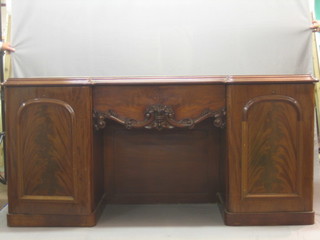 A Victorian mahogany inverted breakfront pedestal sideboard, fitted 1 drawer flanked by a pair of cupboards 74"