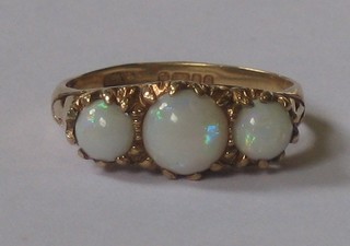 A 9ct gold dress ring set opals