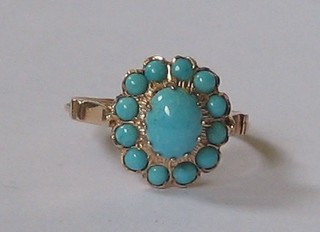 A lady's gold dress ring set turquoise